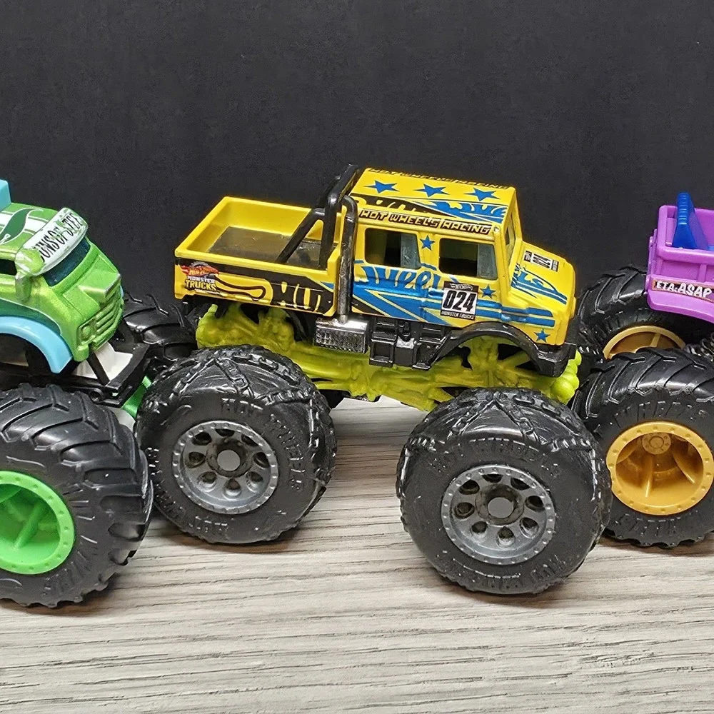 Hotwheels Monster Trucks Lot - Carbonator, Buns Of Steel, Unimog, And Tuk N Roll